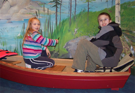 Caleb and Nora in a boat