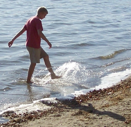 Alex kicking the water