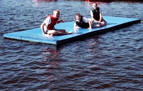 Alex, Caleb, and Corbin on the blue dock