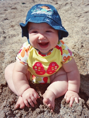 Ella with a beach hat on