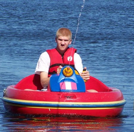 Alex in a boat