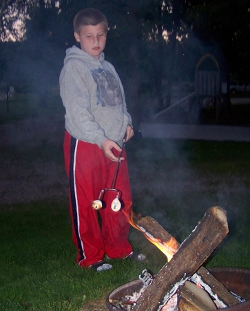 Corbin roasting a marshmallow