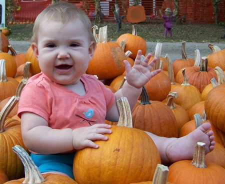 Ella with pumpkins