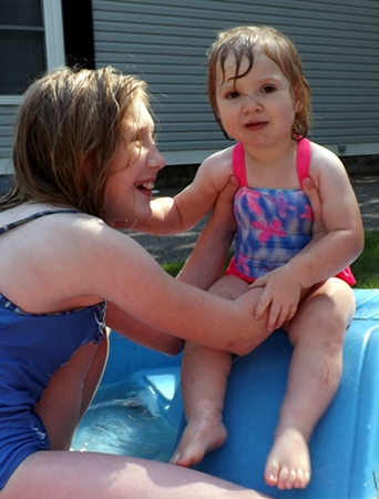 Nora and Ella in the pool