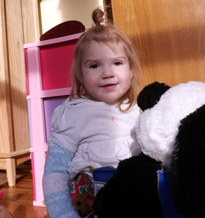 Ella with stuffed animals