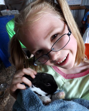 Anna holding a rabbit