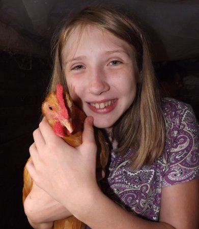 Nora with a chicken