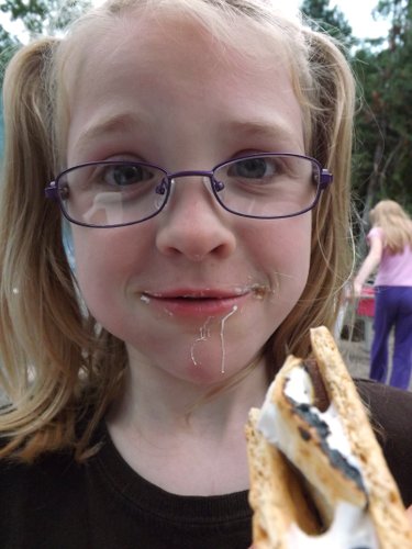 Anna eating s'mores
