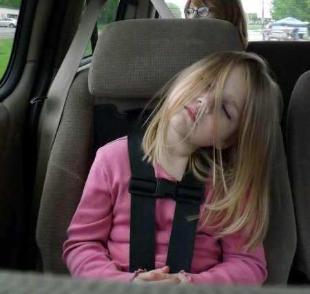 Ella sleeping in her car seat