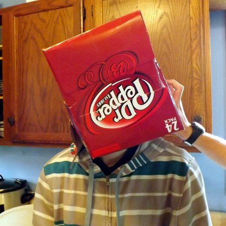 Caleb with a dr. pepper box on his head