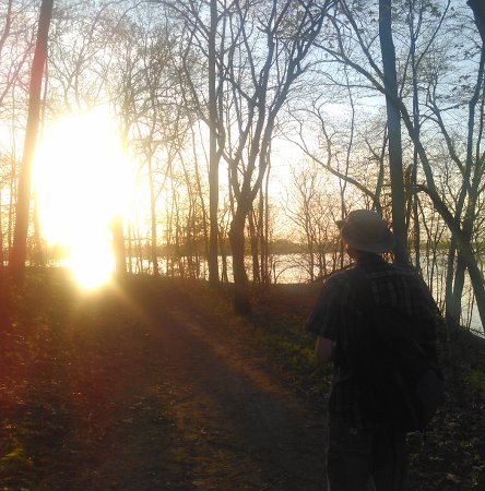 Caleb walking towards the sunset