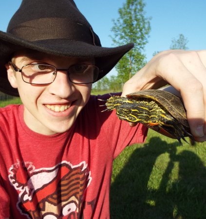 Caleb holding a turtle