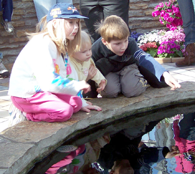 Corbin, Nora, and  Anna at a pond