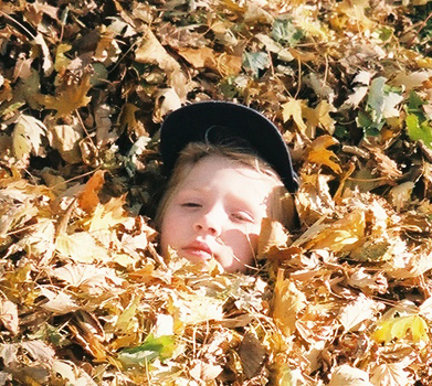Nora in the leaves