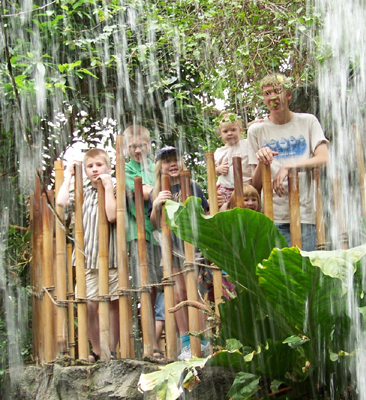 the kids from a view under a waterfall
