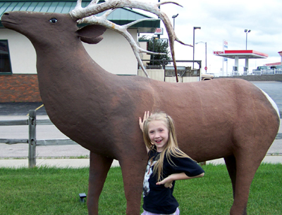 Nora's turn with the elk statue