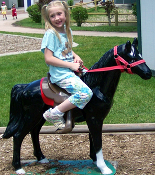 Nora on a pretend horse