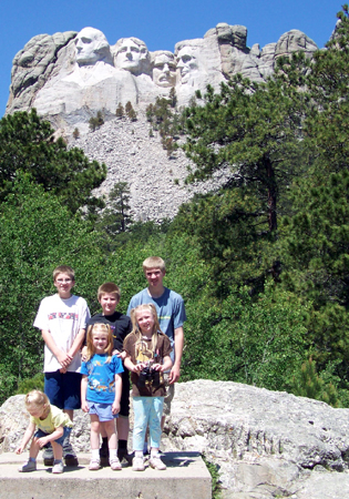 the kids with Mt Rushmore in the background