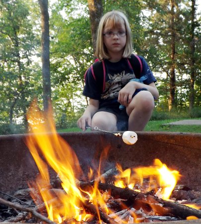 Anna roasting a marshmallow
